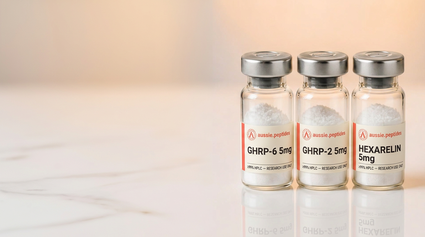 A group of branded Aussie Peptides GHRP-6, GHRP-2 and Hexarelin vials on a warm cream backdrop — discounted GH peptide research stacks shipped in Australia